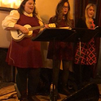 The Pink Adobe - Christmas carolers setting the mood and spirit! - New Mexican Cuisine Near Me - Santa Fe, New Mexico