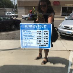 Two Friends Flowers - Posted hours on front door