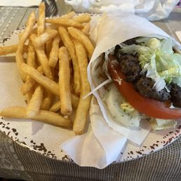Beef Tikka Gyro and Fries. Beef Tikka Gyro and Fries.