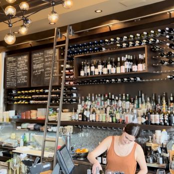 Bodega - a woman behind the bar at a restaurant - Tapas/Small Plates Near Me - Victoria, British Columbia Bodega - a woman behind the bar at a restaurant - Tapas/Small Plates Near Me - Victoria, British Columbia