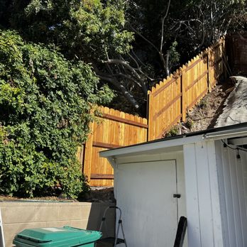 Modesto Ayala Fence - New redwood fence with metal posts on steep hillside between neighbors property - Fences & Gates Near Me - San Diego, California Modesto Ayala Fence - New redwood fence with metal posts on steep hillside between neighbors property - Fences & Gates Near Me - San Diego, California