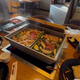 Hotpot and a bottle of hot sake. Hotpot and a bottle of hot sake.