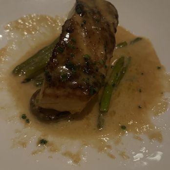 The Capital Grille - Pan-Seared Sea Bass with Shiitake Mushrooms, Asparagus and Miso Butter - Steakhouses Near Me - Livonia, Michigan