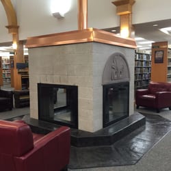 Community Library Network at Post Falls - Ah, a cozy fireplace to warm by with a book that carries us some where warm in the Winter months.