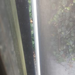 gap between glass patio door and screen. You can see the ivy. gap between glass patio door and screen. You can see the ivy.