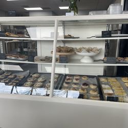 The Co-Op Bakery and Bistro - Baked goods cabinet with tiny pies, muffins, scones, and bars