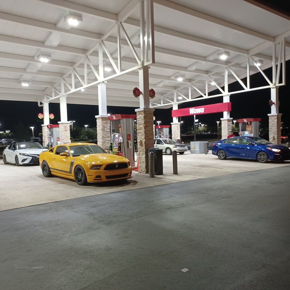 Wawa - a gas station at night with cars parked - Fast Food Near Me - Ocala, Florida Wawa - a gas station at night with cars parked - Fast Food Near Me - Ocala, Florida