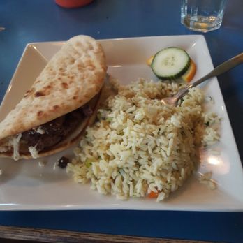 Cafe Akroteri - The lamb gyro with a side of rice, finished off with a cucumber and orange slice for a beautiful presentation! - Greek Near Me - Bellingham, Washington