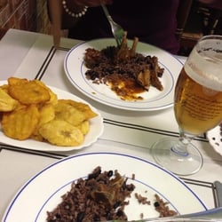Puerto Plata - Goat stew with fried plantains and rice.