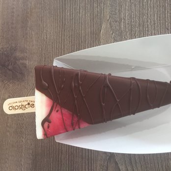 Dipsticle - Pomegranate Creme dipsticle dipped in dark chocolate. - Gelato Near Me - Cordova, Tennessee Dipsticle - Pomegranate Creme dipsticle dipped in dark chocolate. - Gelato Near Me - Cordova, Tennessee