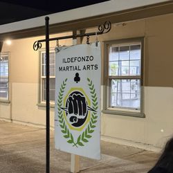 Ildefonzo Martial Arts - Logo in front of dojo