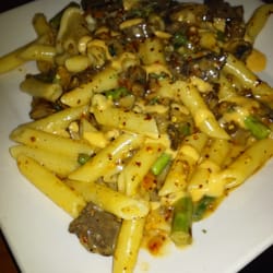 O'Charley's Restaurant & Bar - Prime Rib Pasta - prime rib, bacon, asparagus, and mushrooms tossed with penne and alfredo. Topped with horseradish sauce.