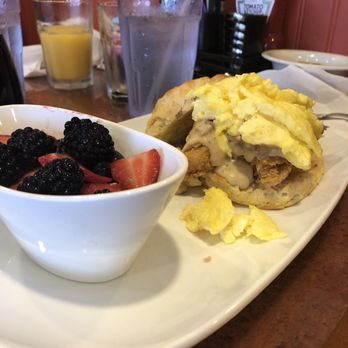 Another Broken Egg Cafe - My wife's meal, broken egg biscuit with chicken and gravy with a fruit mix. - Breakfast & Brunch Near Me - Indianapolis, Indiana