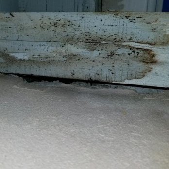 Expert Stucco - Before, hole in stucco behind wood - Stucco Services Near Me