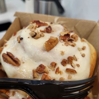 Cinnaholic - a pastry in a box with a fork - Bakeries Near Me - Carmel, Indiana Cinnaholic - a pastry in a box with a fork - Bakeries Near Me - Carmel, Indiana