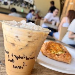 Lola Coffee - Iced Irish cream oatmilk latte , decaf with a splash of half and half :)