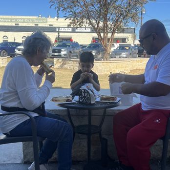 House of Cheese - outside seating. All enjoying the delicious grilled cheese - Specialty Food Near Me - Marble Falls, Texas