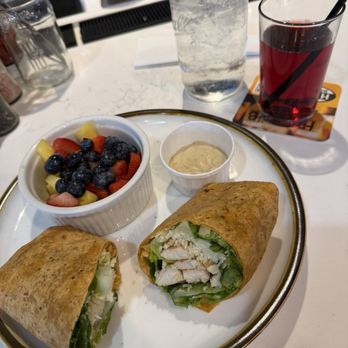 Village Corner Comfort Kitchen & Bar - Chicken Caesar Wrap with fruit salad - Southern Near Me - CONCORD, North Carolina Village Corner Comfort Kitchen & Bar - Chicken Caesar Wrap with fruit salad - Southern Near Me - CONCORD, North Carolina