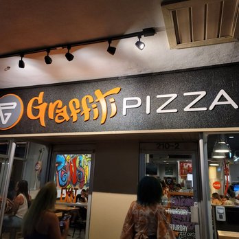 Graffiti Pizza - people walking in front of a restaurant - Pizza Near Me - Pensacola, Florida