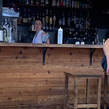 BloodBuzz - a woman sitting at a bar - Cocktail Bars Near Me - Portland, Oregon BloodBuzz - a woman sitting at a bar - Cocktail Bars Near Me - Portland, Oregon