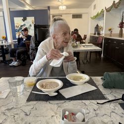 Terraza Court Senior Living - Senior relative enjoying her diet specific (pureed) lunch.