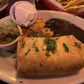 El Chupacabra - Vegan chimichanga with vegan sour cream with rice and beans. - Bars Near Me - Seattle, Washington