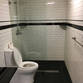 One Week Bath - Before - only half glass, water would spill out onto the floor every time - General Contractors Near Me - Van Nuys, California