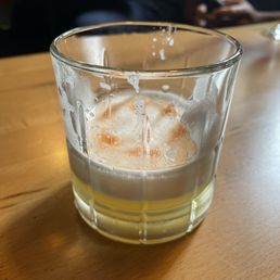 Whiskey Sour w real egg white and bitters. Half consumed ha ha