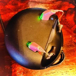 California Hearing Center - Oticon charger with my pink aids :-)