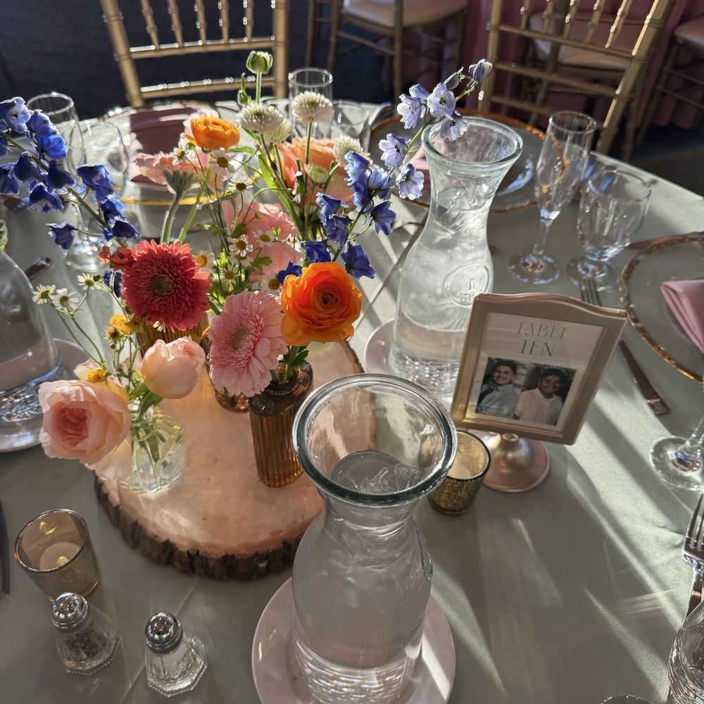 Bud vases as the centerpieces for our tables Bud vases as the centerpieces for our tables