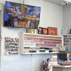 Western Nails & Spa - Food vlog in the background and nail color wall