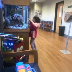 Pediatric Associates of Gresham - Aquarium, front door, book shelf and magazine racks