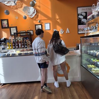 DOLCE & AMARO ARTISAN BAKERY - The young couple ordering something to go. - Bakeries Near Me - Greensboro, North Carolina DOLCE & AMARO ARTISAN BAKERY - The young couple ordering something to go. - Bakeries Near Me - Greensboro, North Carolina
