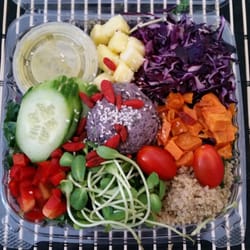 Chef Veganessa - Southern salad: kale, spinach, pineapple, quinoa, sweet potatoes, tomatoes, cucumber, black bean hummus pate and cilantro lime dressing.