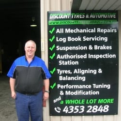 Discount Tyres and Automotive - Colin, Owner of Discount Tyres & Automotive in front of the workshop