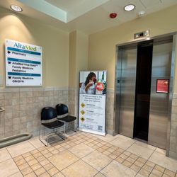 AltaMed Medical Group - Santa Anita Ave - An internal view showing a sign guide along with elevator access offered at this location.