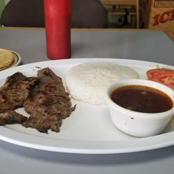La Frontera Market & Deli - Carne asada platter. (Very good flavor) (Grilled skirt steak served with rice, beans, salad and 2 handmade tortillas)