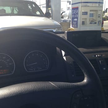ampm - the dashboard of a car at a gas station - Convenience Stores Near Me - Lancaster, California