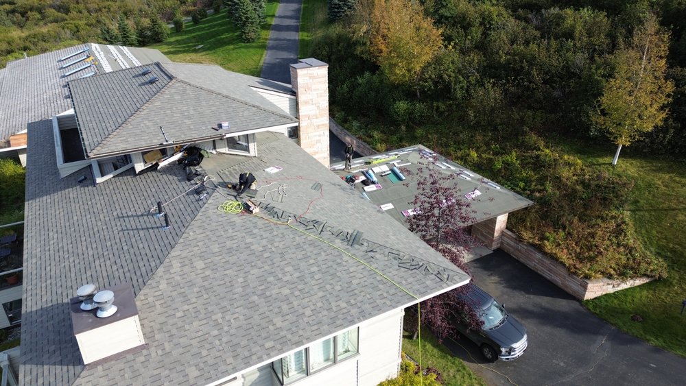 Slide of Reds Roofing & Renovations