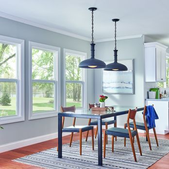 Builders FirstSource - Bright daylight streams into an open-concept dining room through a trio of prominent white double-hung windows, showcasing a ... - Building Supplies Near Me - Sedona, Arizona