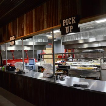 Country Cousins Barbecue - The serving line, kitchen and red reserve pit. - Barbeque Near Me - Centerville, Texas