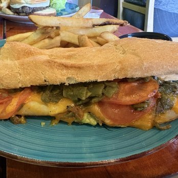 The Daily Grind - ABQ Sandwich - Aka the Albuquerque Turkey! This version is Turkey, cheese, green chile, grilled tomato and avocado all on a baguette. - Coffee & Tea Near Me - Albuquerque, New Mexico