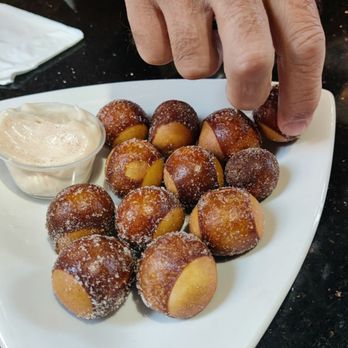 The Garrison - little buckeye dough balls fried and served with vanilla cream dessert, complimentary birthday dessert for our table - American Near Me - Fremont, Ohio