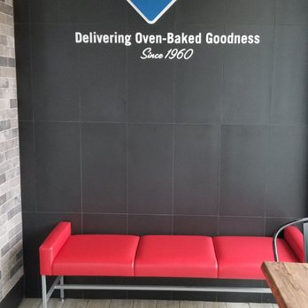 Domino's Pizza - a red bench in front of a black wall - Pizza Near Me - North York, Ontario Domino's Pizza - a red bench in front of a black wall - Pizza Near Me - North York, Ontario