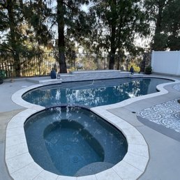 Finished pool . Note mismatched rust colored concrete. Fully cured