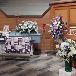Colors were beautiful on the standing arrangement & casket spray!