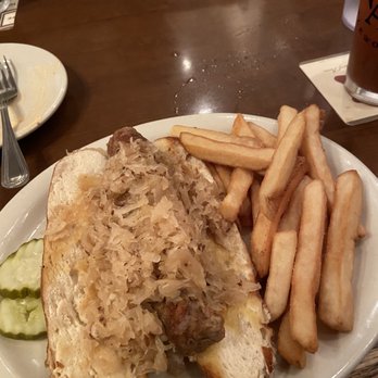 Crystal Beer Parlor - Fresh bratwurst with sauerkraut on a pretzel bun - Southern Near Me - Savannah, Georgia