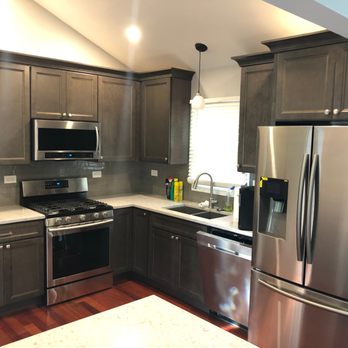Quintessential Renovations - a kitchen with stainless steel appliances - General Contractors Near Me - Grayslake, Illinois