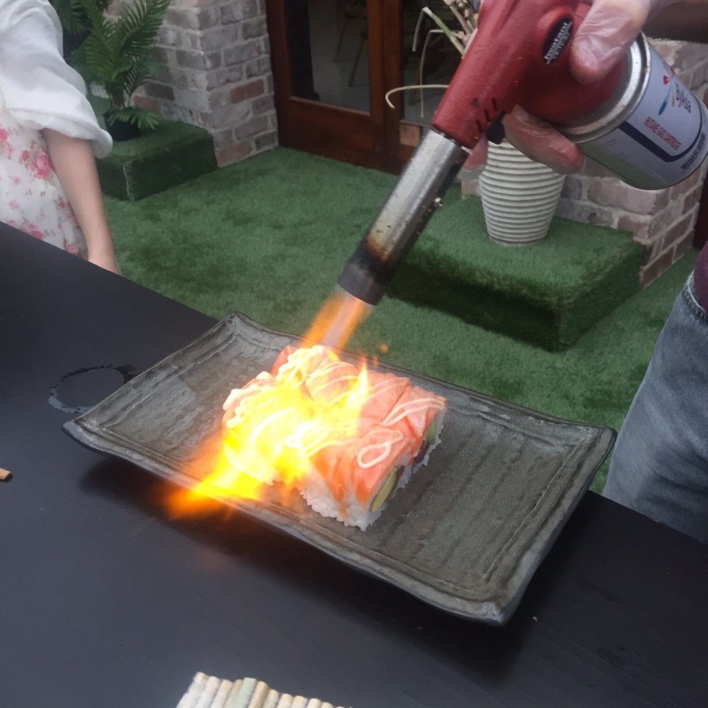 Crane Bar Restaurant - Torching salmon on an inside out roll - Sushi Bars Near Me - Potts Point, NSW