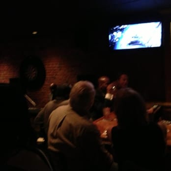 Nomad Bar - a group of people sitting at a bar - Bars Near Me - Wilmington, Delaware Nomad Bar - a group of people sitting at a bar - Bars Near Me - Wilmington, Delaware